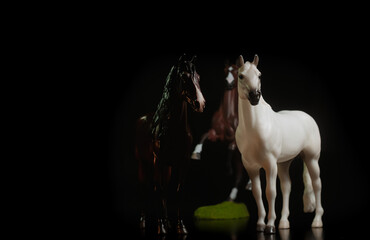 Obraz na płótnie Canvas Black toy horse isolated on black background
