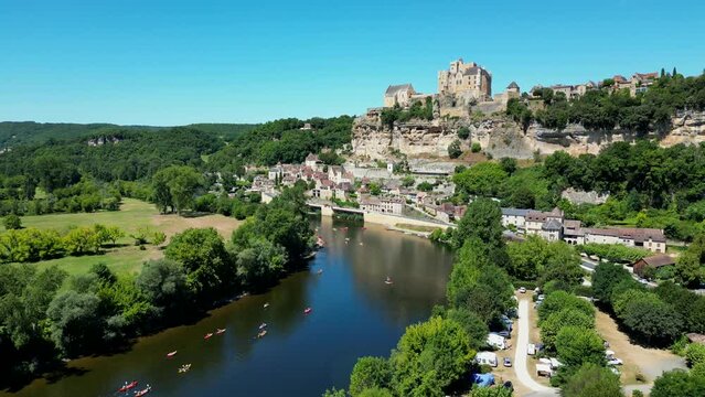 Aerial view Beynac castle and canoes on the river dordogne perigord France, High quality video