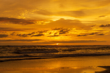 Naklejka na ściany i meble Seascape - sunset on the beach, waves, horizon. Top view. landscape