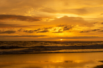 Seascape - sunset on the beach, waves, horizon. Top view. landscape