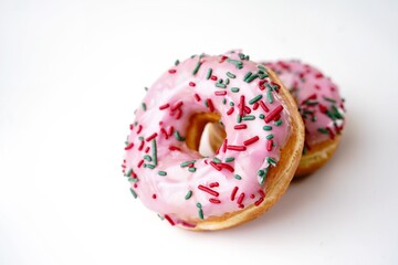  Pink Strawberry sprinkle donuts isolated on white background