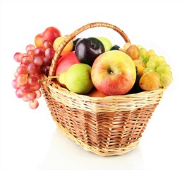 Mixed fruit in a wicker basket on a white background