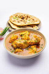 Red Chicken Curry or murgh Masala or korma with prominent Leg Piece