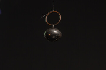 Fototapeta na wymiar Solid brass or bronze vintage bell on black background