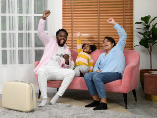 African parents and daughters are packing suitcases for the trip