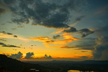 Silhouette of sunset and dramatic sky over the mountain