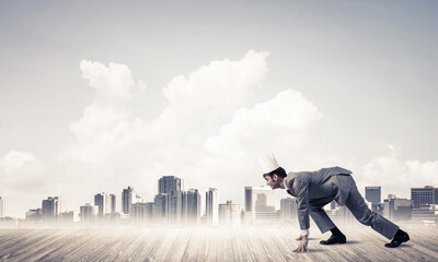 King businessman in elegant suit running and modern cityscape at background