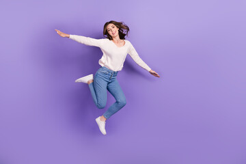 Full length photo of crazy childish good mood lady rejoice win ticket trip abroad empty space isolated on purple color background