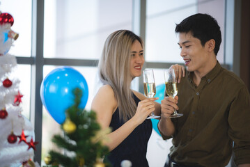 Two Asian young people cute couple husband guy wife lady drink hot beverage x-mas eve spend time magic land newyear, Christmas celebrate in romantic love together with family, happy holiday concept