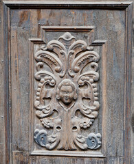 Detail of the wooden door of a church in Romania