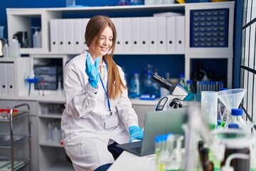 Young caucasian woman scientist smiling confident having video call at laboratory
