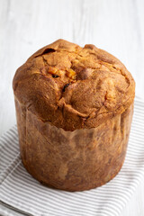 Homemade Italian Panettone with Raisins and Large Pieces of Candied Fruit, side view.