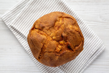 Homemade Italian Panettone with Raisins and Large Pieces of Candied Fruit, top view. Flat lay, overhead, from above.