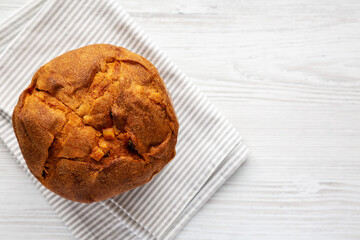 Homemade Italian Panettone with Raisins and Large Pieces of Candied Fruit, top view. Flat lay, overhead, from above. Copy space.