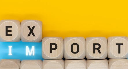 Import and export symbols. Combination of wooden cubes with the words export and import