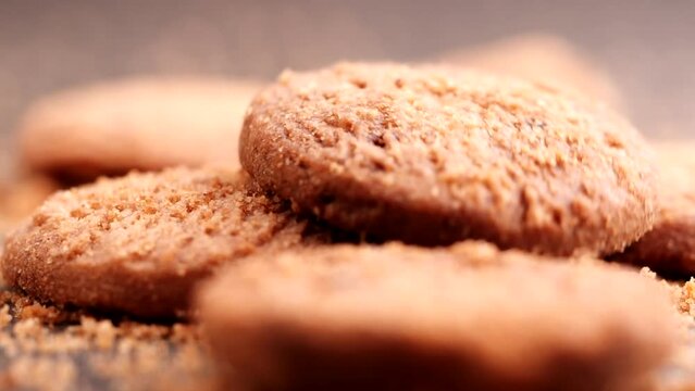 Chocolate chip cookies falling, dropping into table, slow motion. Concept of Dessert, Snack, Biscuit, Chocolate Cookies, Bakery, American Food, Unhealthy Food