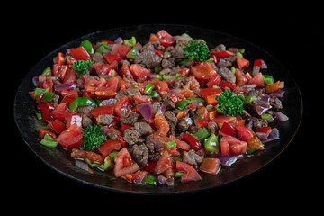 Turkish Food Et Kavurma. Meat Saute Turkish Et sote on black ground. Turkish name : Sac Tava, Sac Kavurma.