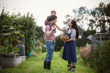 Happy family in backyard garden