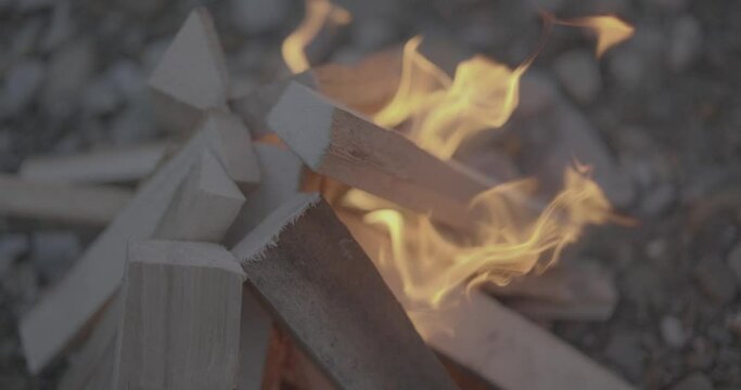 Bone fire detail with flames burning in slow motion from above scene 4K F-LOG video format