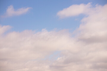 White clouds in the blue sky.