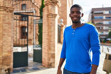 Young african american man smiling confident standing at street