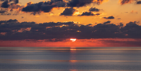 Dramatic Colorful Sunrise Sky over Mediterranean Sea. Abstract Red Sky. Cloudscape Nature Background.