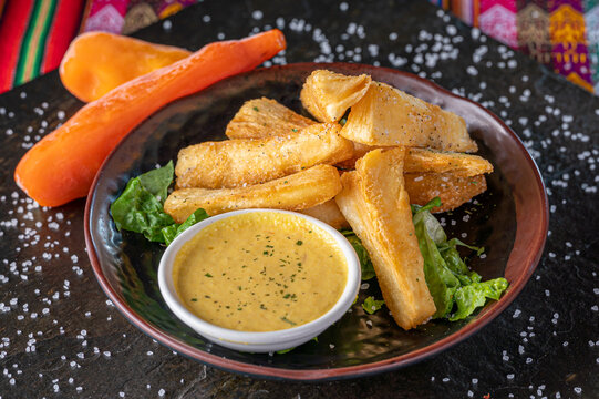 Yuquitas fritas, Peruvian yuca fries with dipping sauce.