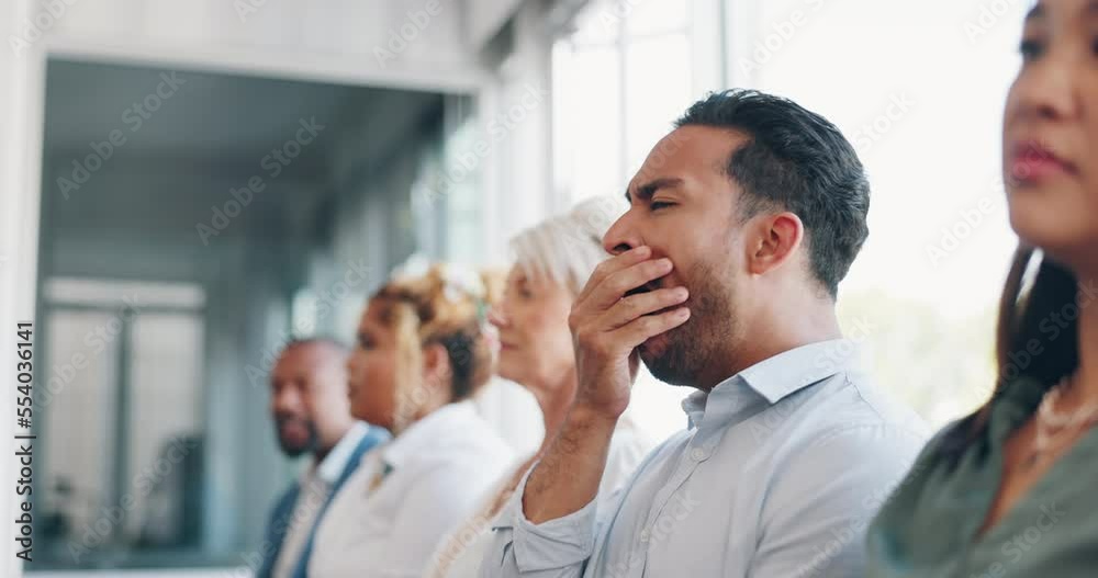 Poster Tired, yawn and sleepless with a business man sitting in a meeting or presentation with his team for development. Yawning, exhausted and bored with a male employee suffering from insomnia at work