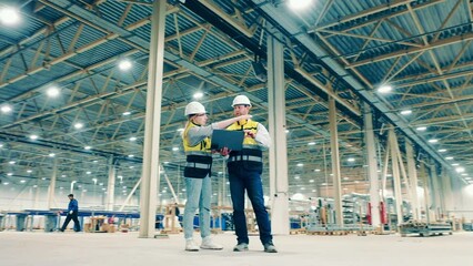 Industrial engineers planning a project in the fiberglass factory