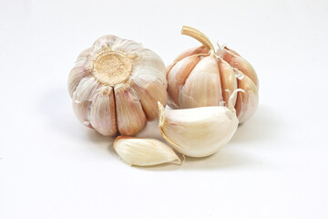Garlic cloves on white background.