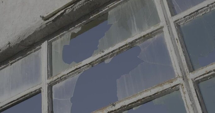 Broken window glass on an old comunist building slow motion 4K F-LOG2 video format