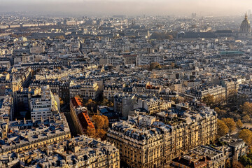 Panoramic aerial view of Paris from Eiffel Tower. Beautiful view of Paris skyline with typical parisian facades in the center.