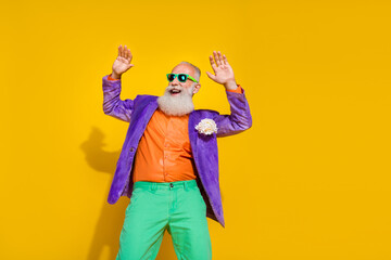 Photo of crazy excited old man dancing boogie woogie on retro disco floor occasion isolated on bright color background