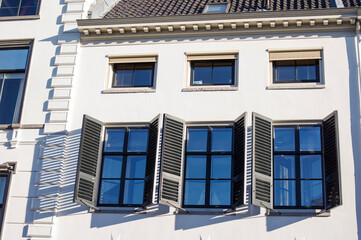 Closeup of the facade with windows of an old luxury villa in Utrecht in the Netherlands