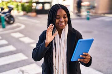 Fototapeta premium African american woman smiling confident having video call at street