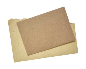 ripped brown paper texture. torn cardboard paper edges background with brown paper at front layer. brown paper for banner tag isolated on white background with clipping path.