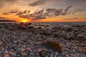 Sunset at sea, Baltic Sea, many rocks