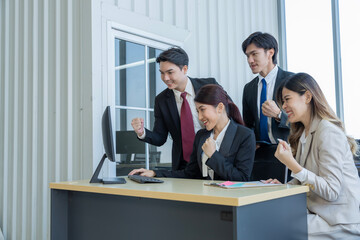 A group of young Asian businessmen Talking and planning work happily and have fun. at the company's office