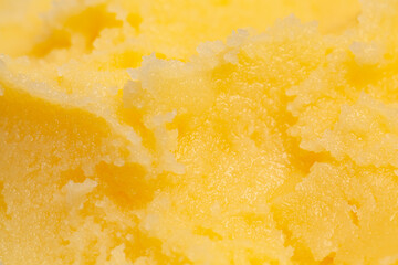 Homemade melted ghee clarified butter close up macro food background