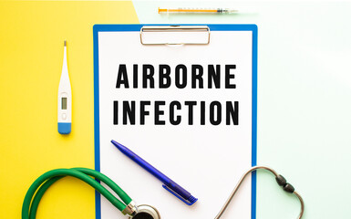 AIRBORNE INFECTION text on a letterhead in a medical folder on a beautiful background.