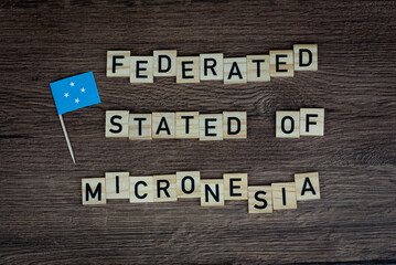 Micronesia - wooden word with micronesia flag (wooden letters, wooden sign)