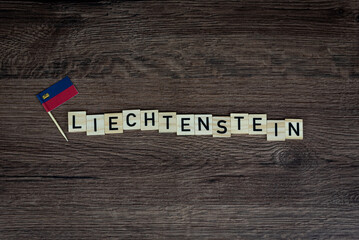 Liechtenstein - wooden word with liechtenstein flag (wooden letters, wooden sign)