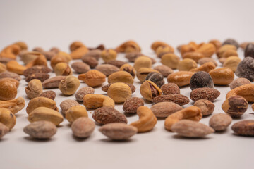  A group of almonds, pistachios, walnuts, macadamia, cashews.