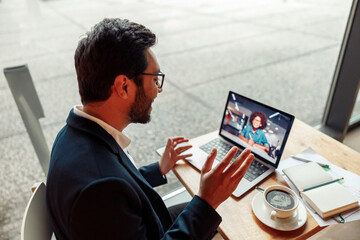 Businessman have a business meeting via video call in cafe
