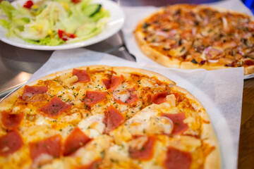  Pizza on plate on wood table with ingredients