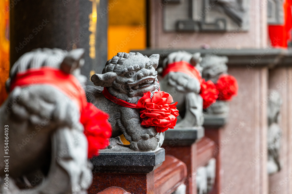 Wall mural lion statue in the chinese temple