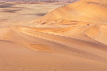 Fototapeta na wymiar Namibia Desert. Aerial View Sand Dunes near Walvis Bay. Skeleton Coast. Namibia. Africa.