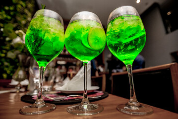 A green drink with lemon and mint