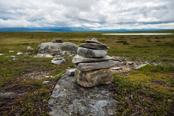 Stacked stones on flatruet fell.