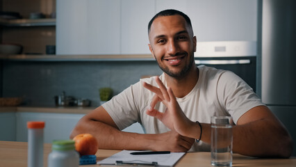 Nutritionist African male man sport fitness athlete trainer sporty guy in kitchen recommend healthy...